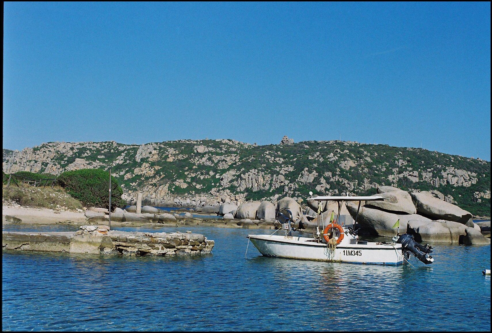 Calm waters and a boat in Sardinia